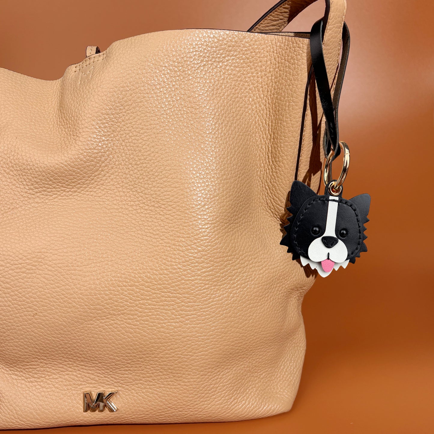 airtag holder handmade leather border collie on shoulder bag