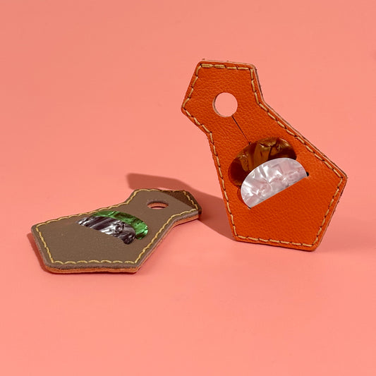 Orange handmade sheepskin leather guitar pick holder in tie shape with pick