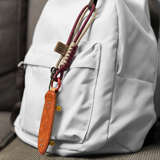 Leather cruiser skateboard keychain attached to backpack, stylish and portable accessory