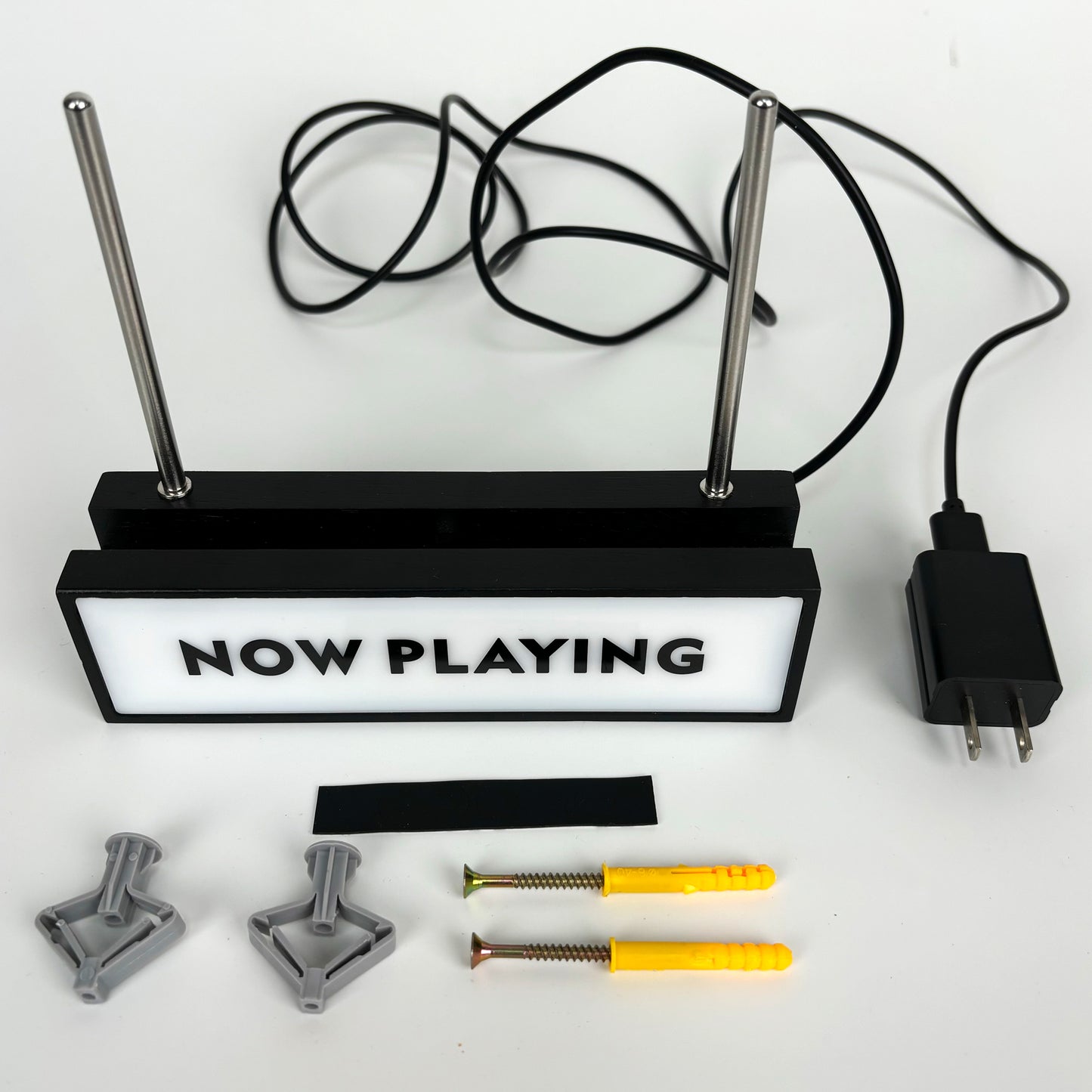 Wall-mountable "Now Playing" LED vinyl record display stand components, including the light unit, support rods, and mounting hardware for vinyl enthusiasts.