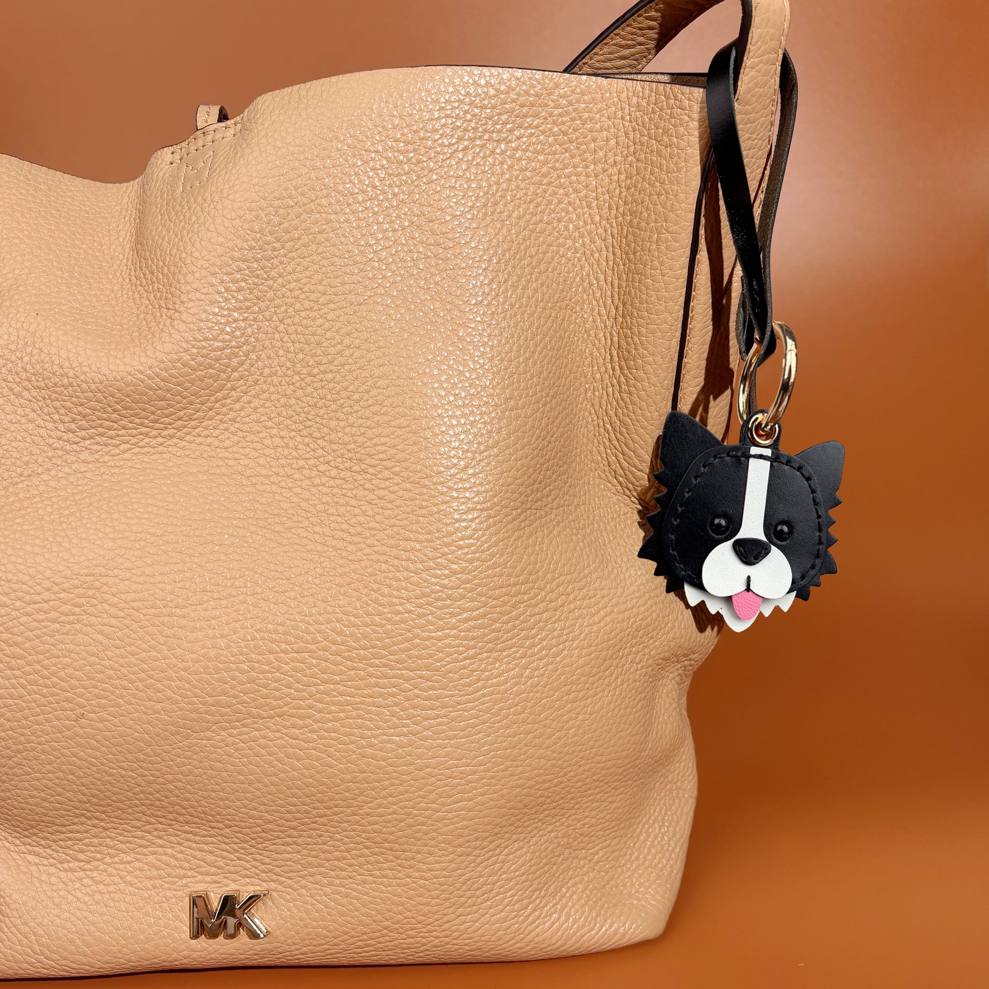 airtag holder handmade leather border collie on shoulder bag