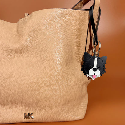 airtag holder handmade leather border collie on shoulder bag