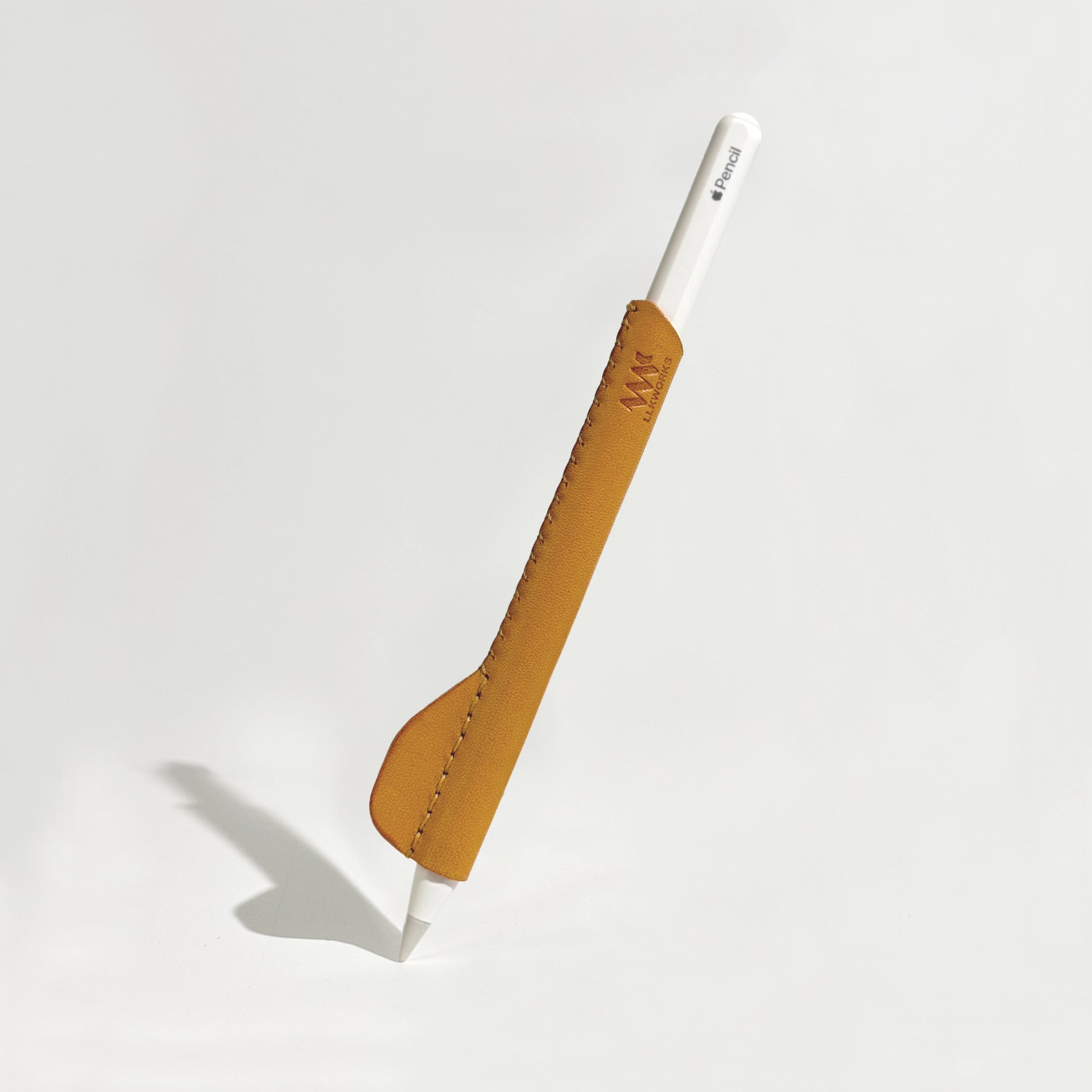 Handmade yellow leather ergonomic grip for Apple Pencil, designed to improve comfort and control during extended use.