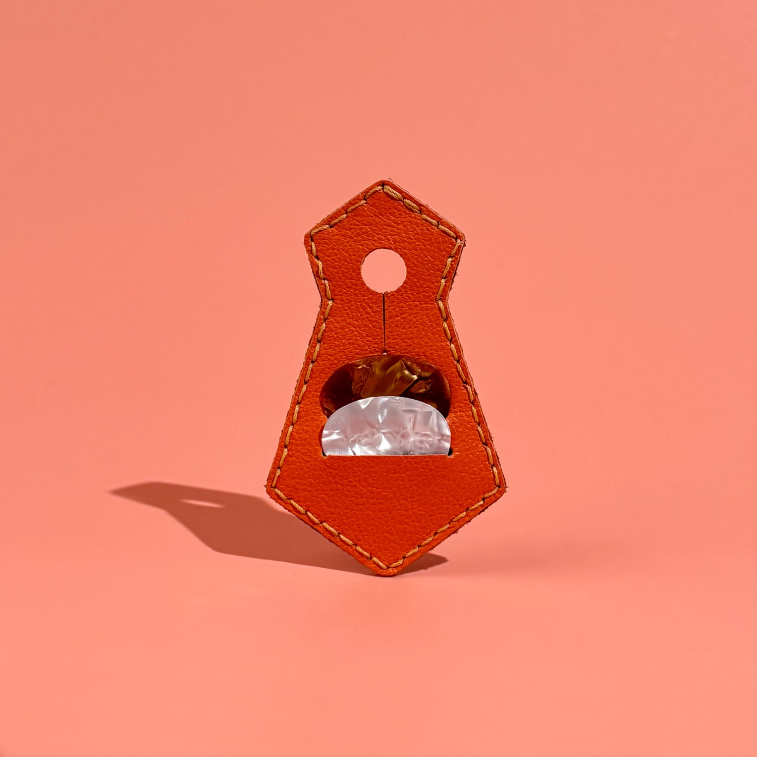 Orange unique tie-shaped leather guitar pick pouch with pick