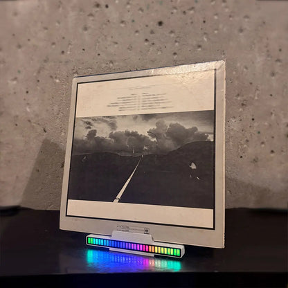 Minimalist design vinyl visualizer display stand for record players with vibrant sound-activated LED lights.