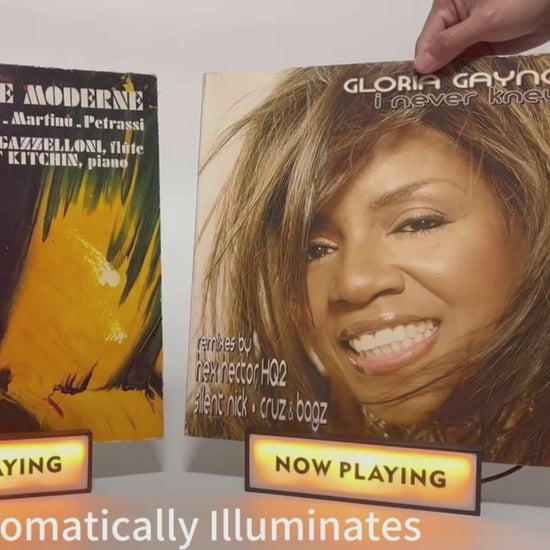 Demonstration of "Now Playing" vinyl record stands, illustrating how to set up and display album covers.