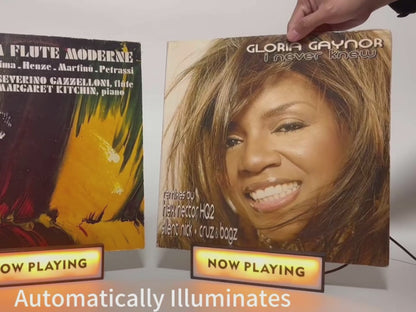 Demonstration of "Now Playing" vinyl record stands, illustrating how to set up and display album covers.