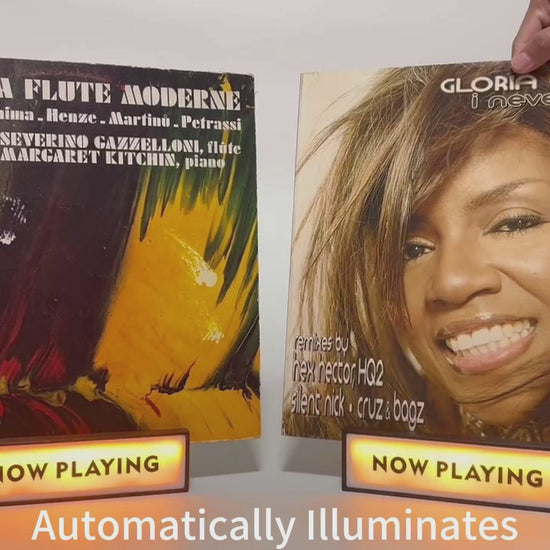 Demonstration of "Now Playing" vinyl record stands, illustrating how to set up and display album covers.