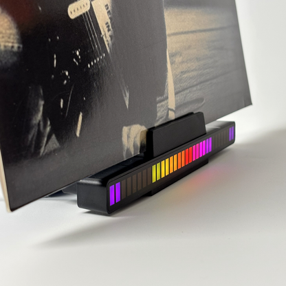 Desktop vinyl record stand with sound-activated RGB LED light bar.