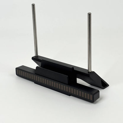 Modern minimalist design of black vinyl record stand with stainless steel support rods.